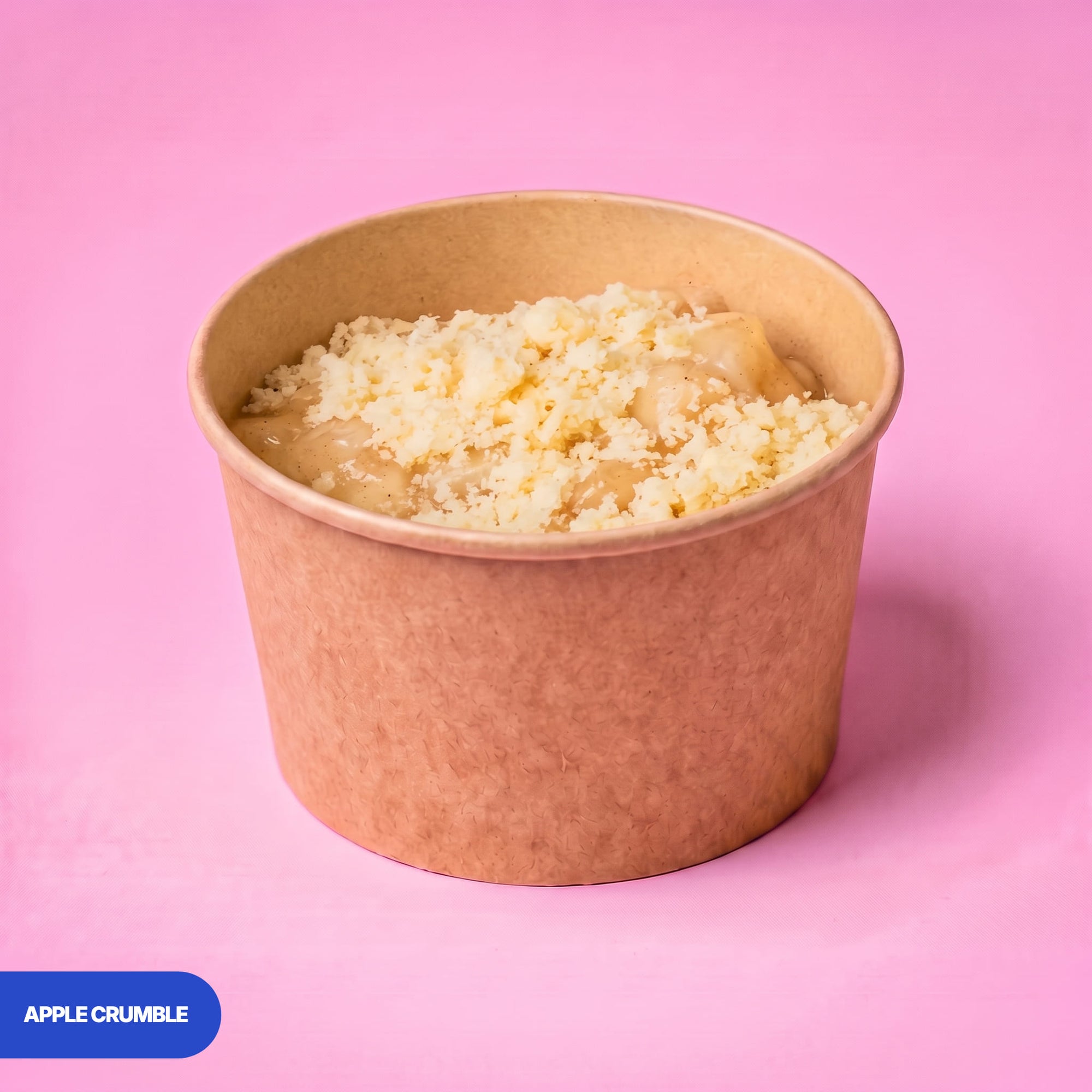 Gluten free vegan apple crumble pot, soft apple under a buttery crumble topping in a kraft tub