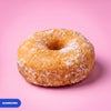 Gluten free vegan baked ring doughnut rolled in caster sugar