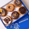 Open Borough 22 box of six gluten free vegan baked chocolate doughnuts, s'mores with toasted marshmallow, salted caramel, jaffa, cookies and cream, and cinnamon sugar