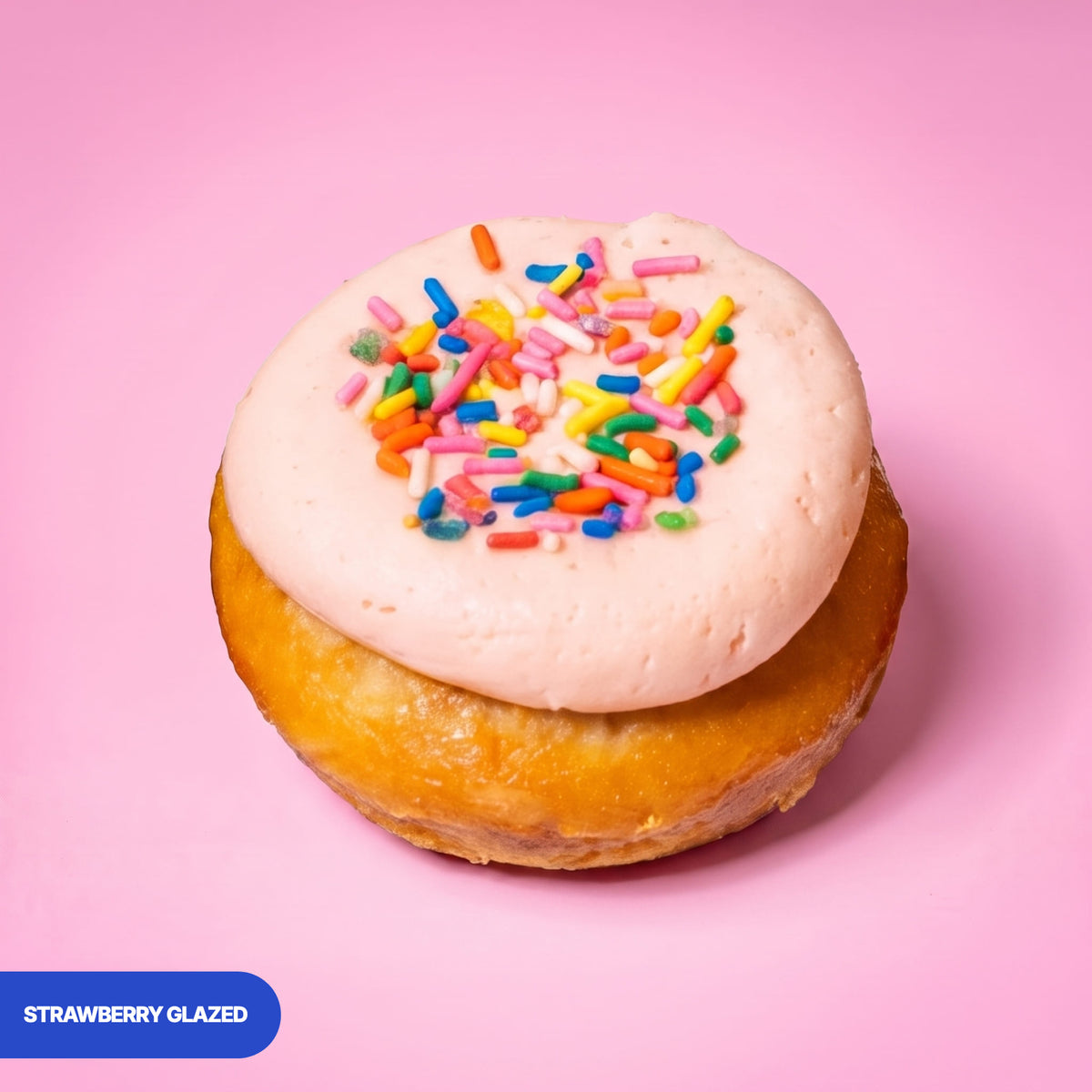 Gluten free vegan baked strawberry glazed doughnut with pink icing and rainbow sprinkles