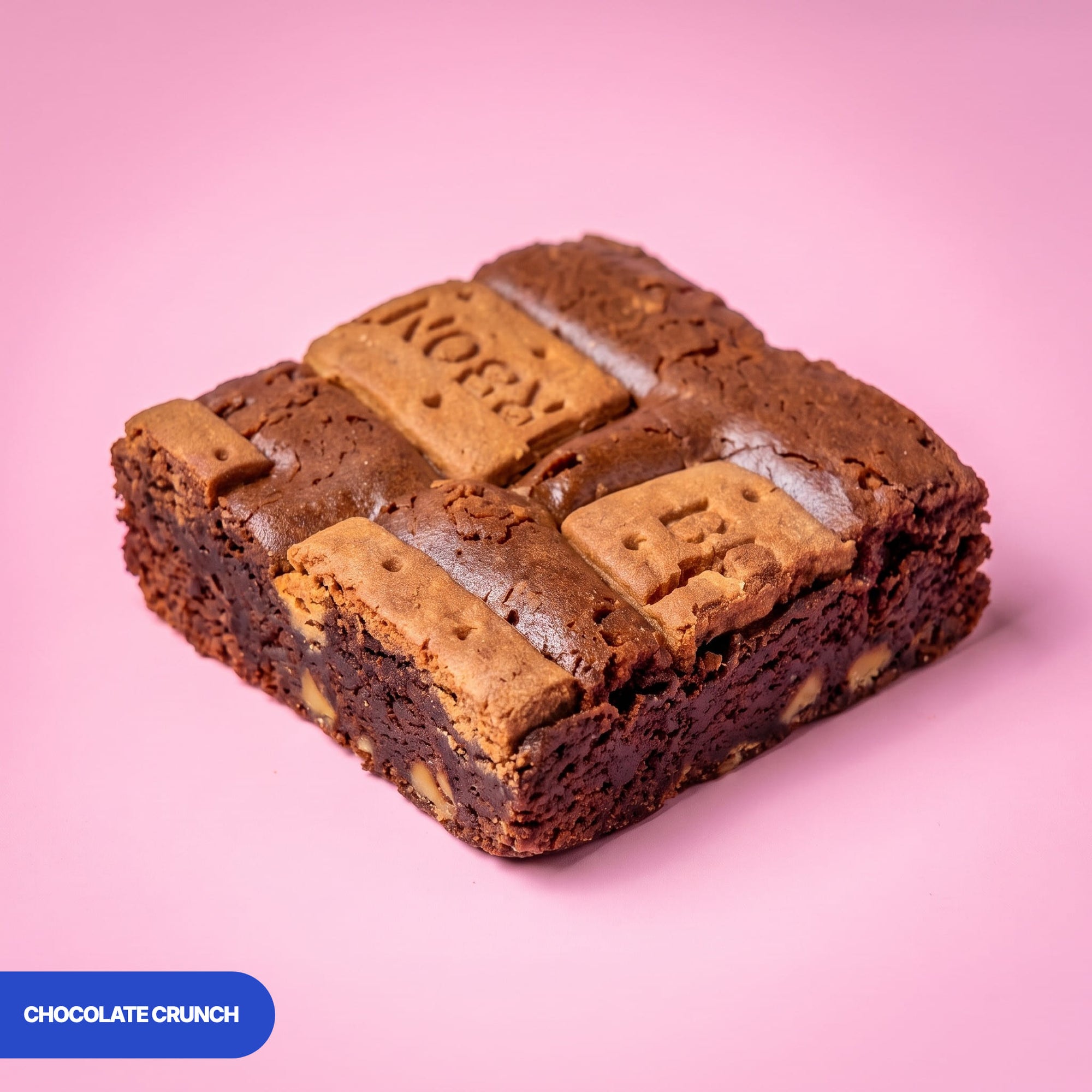 Gluten free vegan chocolate crunch brownie topped with caramelised biscuit, showing the fudgy centre
