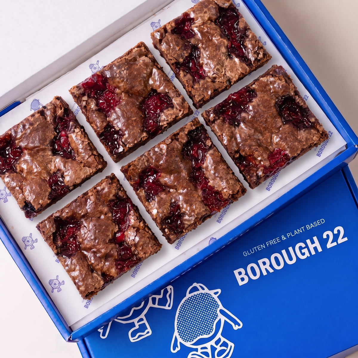 Open Borough 22 box of six gluten free vegan jam puddle brownies with pools of red jam baked into the top