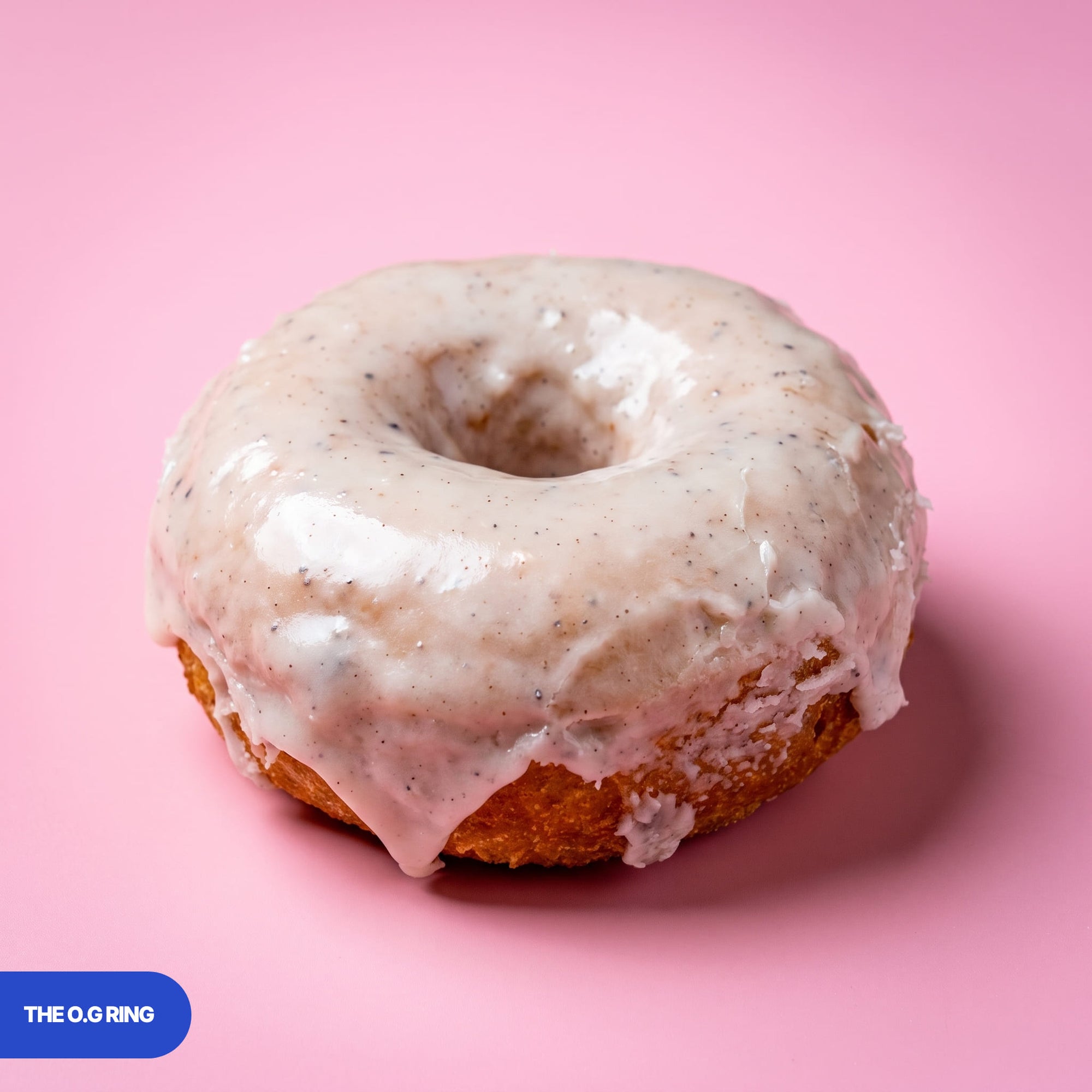 Gluten free vegan fried O.G ring doughnut under a glossy vanilla bean glaze
