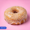 Gluten free oat free vegan fried original glazed ring doughnut under a glossy vanilla glaze