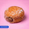 Gluten free oat free vegan fried sugared doughnut filled with chocolate cream, the filling visible at the side