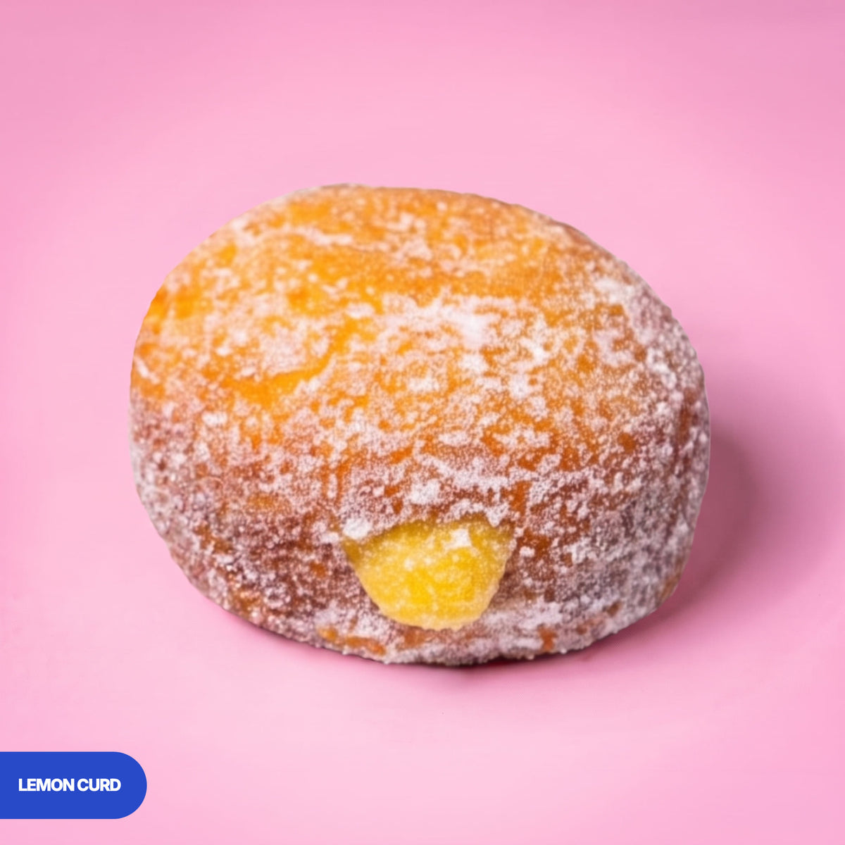 Gluten free oat free vegan fried sugared doughnut filled with lemon curd, the filling visible at the side