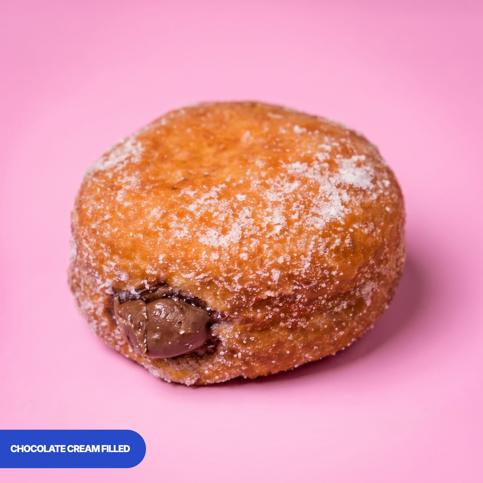 Gluten free oat free vegan fried sugared doughnut filled with chocolate cream, the filling visible at the side