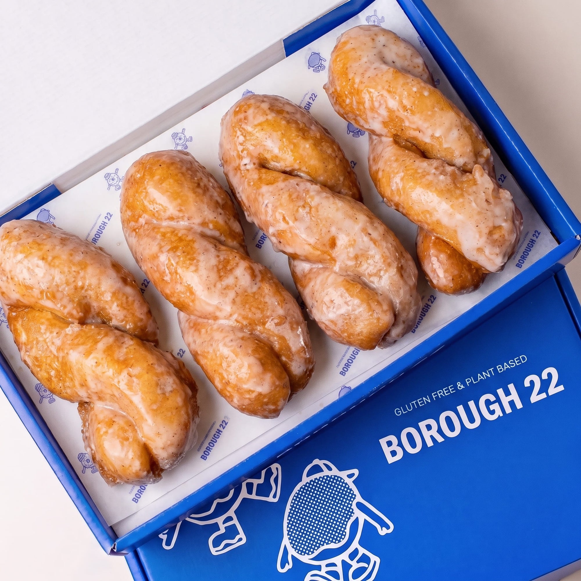 Open Borough 22 box of six gluten free vegan yum yums, twisted doughnut batons under a vanilla glaze